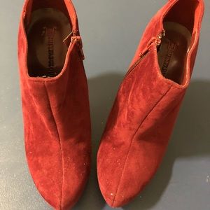 Red suede boots with heels and side zippers